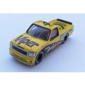 A die cast metal model of a pick up truck aka a bakkie with racing related signage - good quality