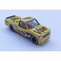 A die cast metal model of a pick up truck aka a bakkie with racing related signage - good quality