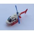 A 1989 die cast metal model of a helicopter by Hotwheels with extending tail boom - Red Cross Jungle