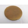 A vintage powder compact with lots of character featuring a stylish young lady