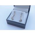 A pair of genuine sterling silver earrings with clear insets - Never worn - With box