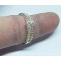 A genuine sterling silver ring with faceted clear insets - Brand new