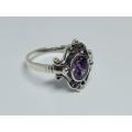 A genuine sterling silver ring with gable design and faceted purple inset - Brand new