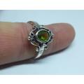 A genuine sterling silver ring with gable design and faceted green inset - Brand new