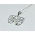 A genuine sterling silver necklace with sterling silver double mask pendant - Brand new