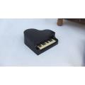 A little lot of 3 piano themed items - Coaster holder , ashtray and pencil sharpener - Bid for all