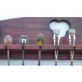 A vintage wooden spoon rack complete with 24 vintage spoons - interesting pieces