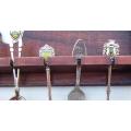 A vintage wooden spoon rack complete with 24 vintage spoons - interesting pieces