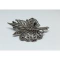 A magnificent vintage solid sterling silver leaf form brooch filled with marcasite