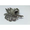 A magnificent vintage solid sterling silver leaf form brooch filled with marcasite