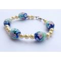 A gorgeous handmade genuine sea Pearl and art glass bead bracelet with sterling silver clasp