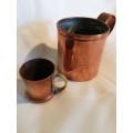 A pair of 19th Century Copper Measuring jugs