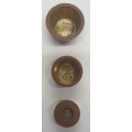 Antique 7 pce set of brass Troy ounce nesting cup weights.