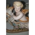Vintage German Porcelain Cherub Angel on Dragon Sleigh. ` Fantastic condition `