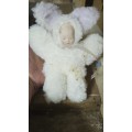 Vintage plush doll with porcelain face
