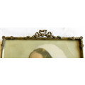 VINTAGE PHOTO FRAME CONTAINING A BEAUTIFUL COLOUR PHOTO OF YOUNG WOMAN, NEWSPAPER CLIPPING INCLUDED