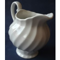 DELICATE LOOKING, WHITE JUG, MADE IN ENGLAND WITH A PRETTY SWIRLING DESIGN,