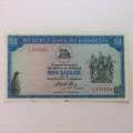 Reserve Bank of Rhodesia One Dollar 13 October 1974 uncirculated with stains on lower rim of note