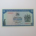 Reserve Bank of Rhodesia One Dollar 2 August 1979 uncirculated with single fold crease