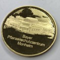 Bayer 100 year medallion in plastic holder