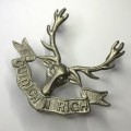Great Britain Seaforth Highlanders (Ross-shire Buffs - The Duke of Albany`s) cap badge - Lugs