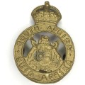SA International metal cap badge
