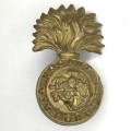 Great Britain Royal Northumberland Fusiliers collar badge, left side, lugs