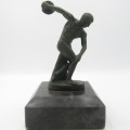 Vintage bronze discus thrower sculpture on stone base