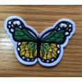 Bufferfly patch in green and yellow on white