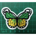 Bufferfly patch in green and yellow on white