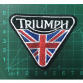 Triumph flag with black and white badge patch