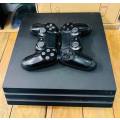 Sony PlayStation 4 PS4 PRO 1TB with 2 controllers (Very good condition)