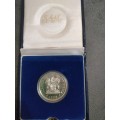 1990 Silver R1 coin in SAM box and capsule