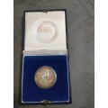 1990 Silver R1 coin in SAM box and capsule