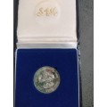 1986 Silver R1 coin in SAM box. Johannesburg