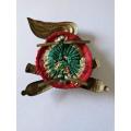 Italian WWII Artillery Badge with all original fastening plates and cloth backing.