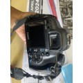 Canon 1000D camera with lens,battery,and charger