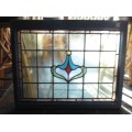 Vintage stained glass window in frame