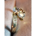 10kt Gold Aquamarine ring with 3 diamonds flanking each side