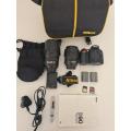 Nikon D90 with 18-105mm lens and 70-300mm lens and accessories