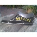 vintage shoe repair sign