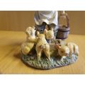 Boy Figurine Feeding Piglets