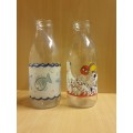 2 Glass Milk Bottles (height 24cm width 9cm)