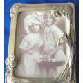Vintage Silver Plated Picture Frame with Embossed Figurine - 160mm X 120mm (Slight wear)