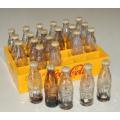 24 Miniature Coca Cola bottles in a plastic crate - Bottle height 65mm - Crate 150mm X 100mm