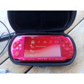 Sony PSP Red with 14 games and a 4GB memory card.