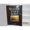 REDUCED TO CLEAR : SOFT COVER BOOK : WELCOME TO OUR WORLD (TOYOTA) - LOT 372U