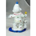 A SMALL CLOWN HOLDING A DOG AND A DRUM - BID NOW!!!
