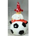 A SMALL CLOWN IN A POLKA DOT SUIT AND HAT ON A LARGE BALL - BID NOW!!!