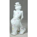 A CLOWN IN A POLKA DOT SUIT STANDING WITH A CANE - BID NOW!!!